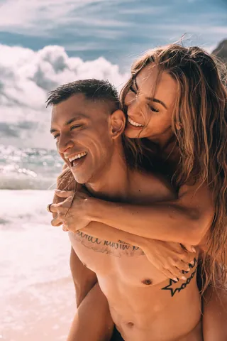 Laughing couple on the beach in Hawaii