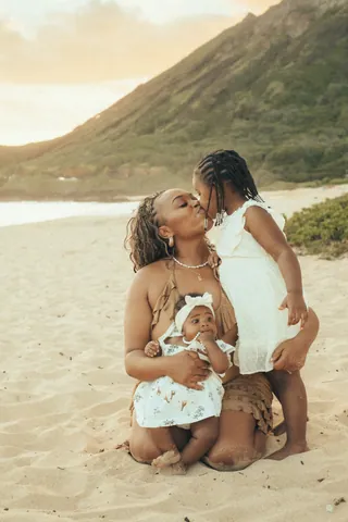 Mother with her daughters on the beach in Hawaii